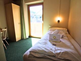 12. Catered chalet Alpensport Saalbach Hinterglemm Eenpersoonskamer